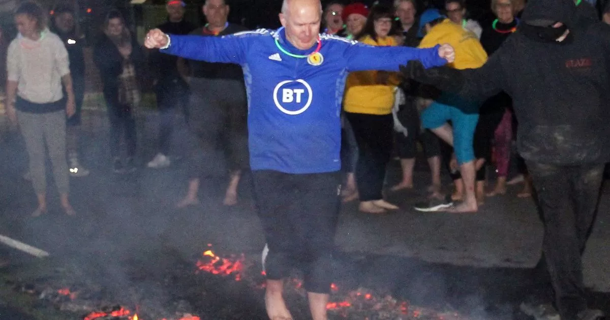 Dumfries granny among brave daredevils to walk across hot coals for Marie Curie