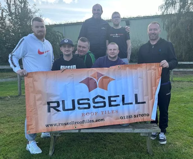 The Lochmaben team at Russell Roof Tiles who raised £4,000 for local causes from charity skydive