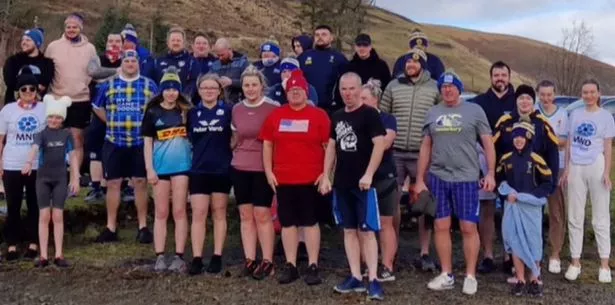 Moffat Rugby Club and supporters took an early morning dip in the Loch of Lowes to help Team South in this year's Doddie Aid challenge