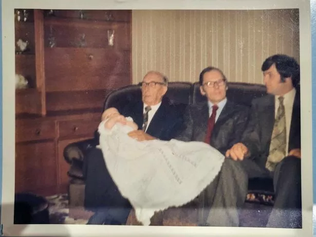 Four Ross generations Grandpa Matt holding baby Lindsay, Jim and young Jim