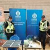 Two Police officers in uniform, at a recruitment event