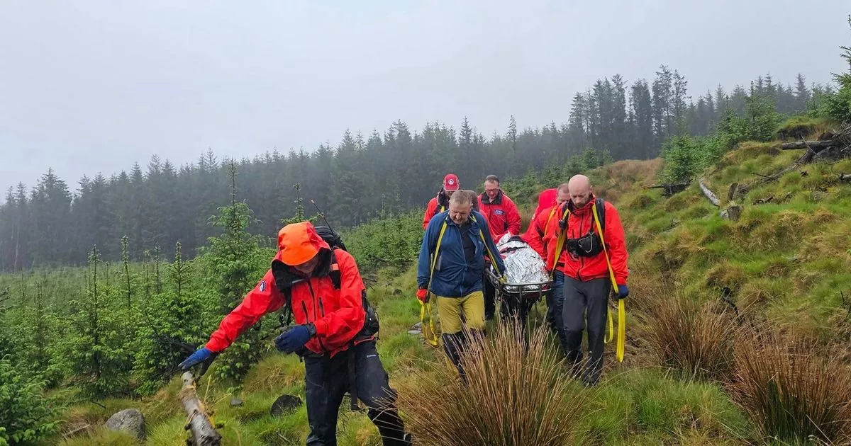 Galloway Mountain Rescue Team stretcher injured walker off Pibble Hill